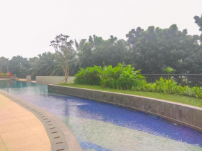 Homey and Modern Look 2BR Transpark Cibubur Apartment By Travelio